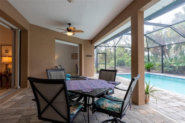 interior space with ceiling fan and a swimming pool