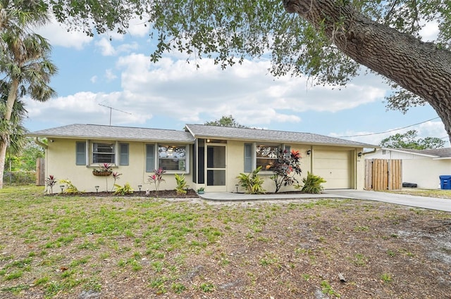 ranch-style home with a garage and a front yard