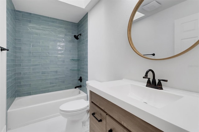 full bathroom with toilet, tiled shower / bath combo, and vanity