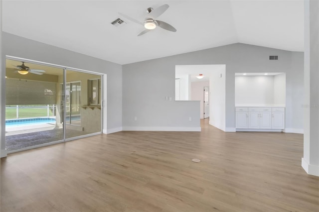 unfurnished living room with lofted ceiling, ceiling fan, and light hardwood / wood-style flooring