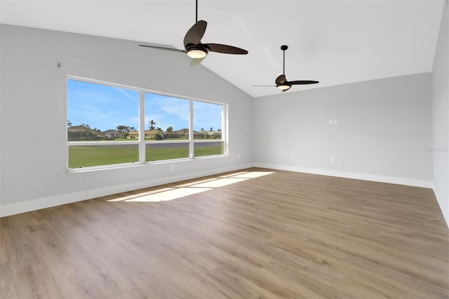 spare room with light hardwood / wood-style flooring, lofted ceiling, and ceiling fan