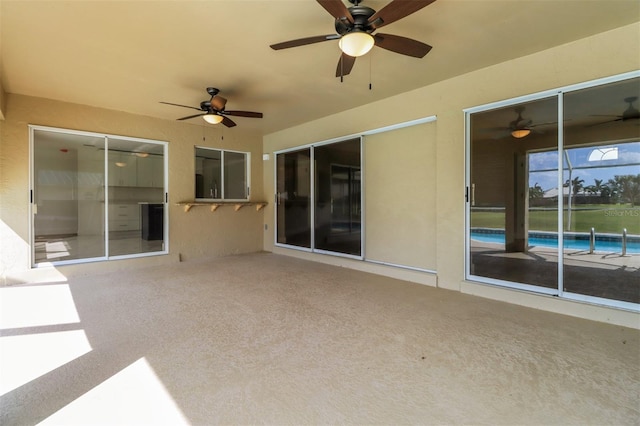 view of patio / terrace featuring ceiling fan