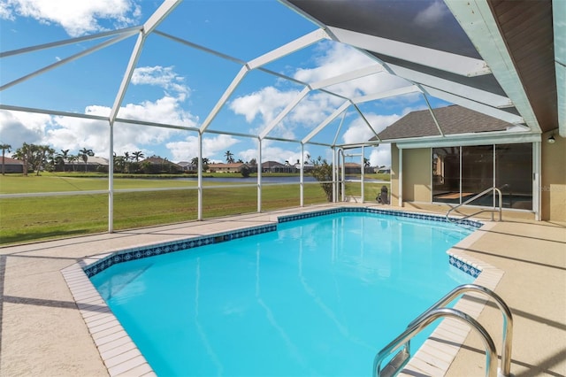 view of pool featuring a patio area, a yard, and a lanai