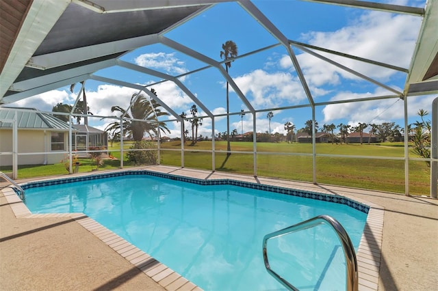 view of pool featuring a lanai, a patio, and a yard