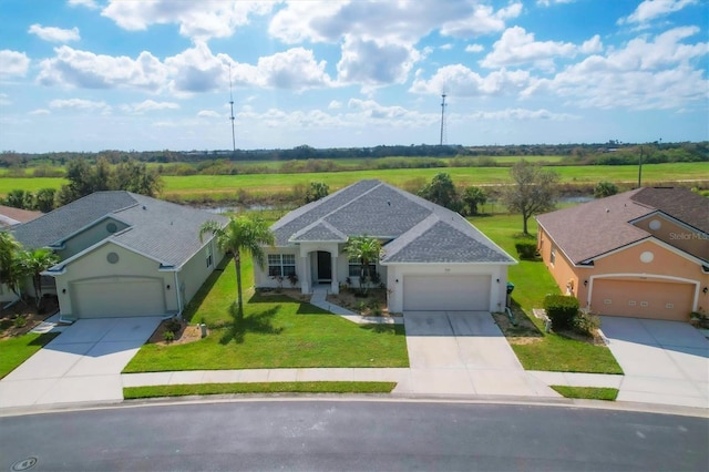 view of front of home featuring a front lawn and a garage