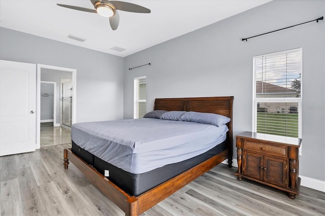 bedroom with hardwood / wood-style floors and ceiling fan