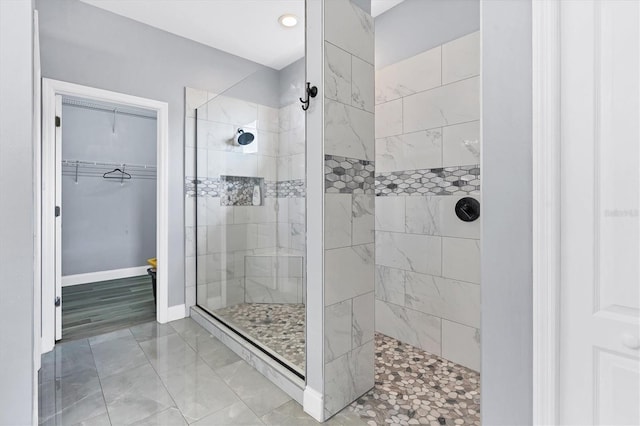 bathroom with tiled shower