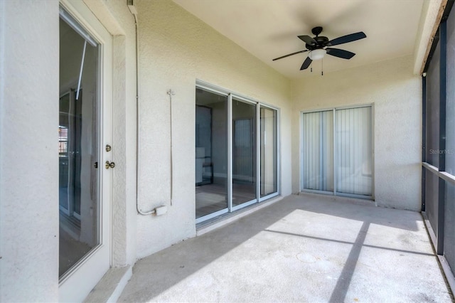 exterior space featuring ceiling fan