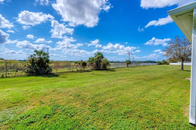 view of yard with a rural view