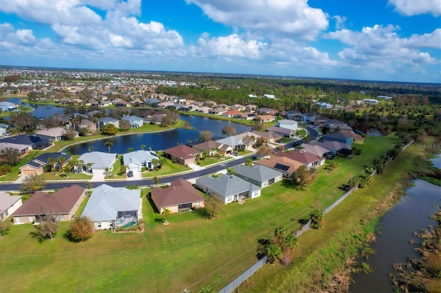 drone / aerial view with a water view