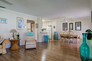 2609 Riverbluff Pkwy Unit 146, Sarasota, FL 34231 - living room with ornamental molding, wood finished floors, and a ceiling fan