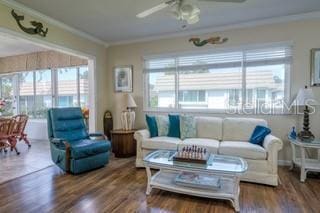 2609 Riverbluff Pkwy Unit 146, Sarasota, FL 34231 - living room featuring ceiling fan, wood finished floors, and crown molding