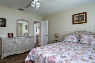 bedroom featuring dark wood-type flooring and ceiling fan