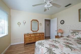 bedroom featuring ceiling fan and hardwood / wood-style flooring