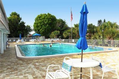 2609 Riverbluff Pkwy Unit 146, Sarasota, FL 34231 - community pool with fence and a patio area