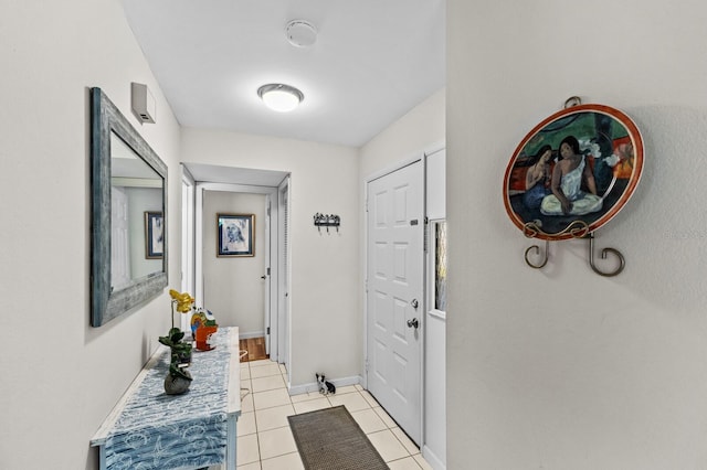 hall featuring light tile patterned floors