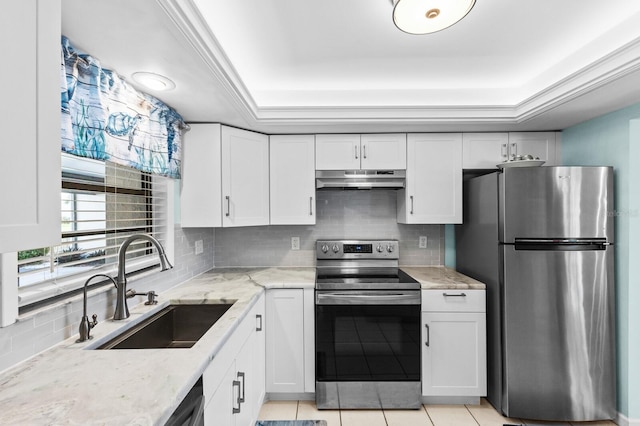 kitchen featuring white cabinets, sink, light tile patterned floors, and stainless steel appliances