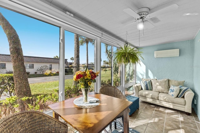 sunroom / solarium featuring ceiling fan and an AC wall unit