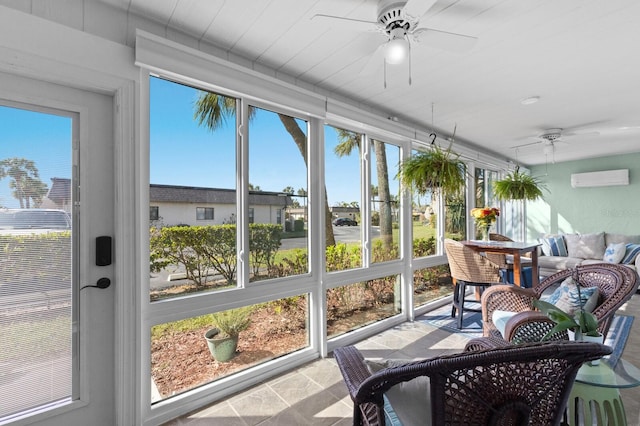 sunroom with a wall mounted AC and ceiling fan