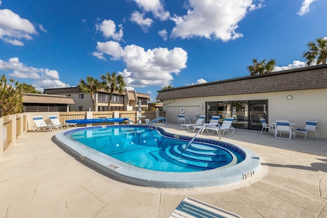 view of swimming pool featuring a patio