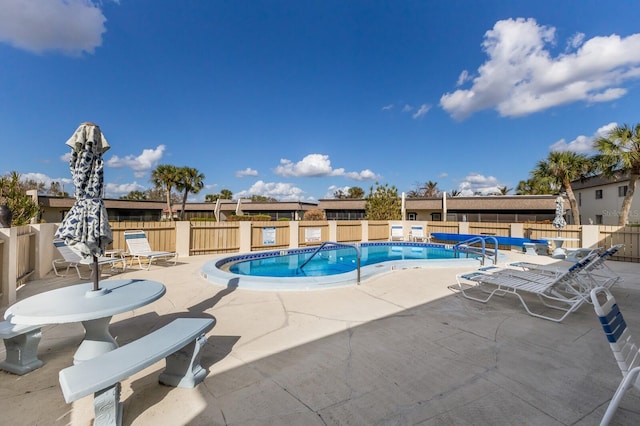 view of pool featuring a patio