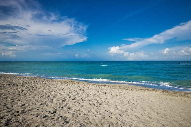 view of water feature with a beach view