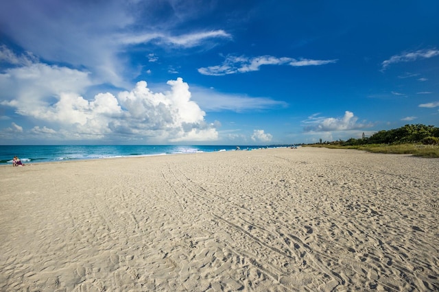 view of water feature with a beach view