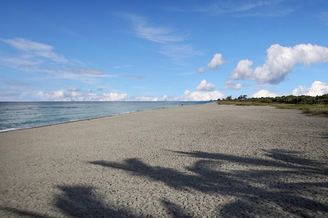 property view of water featuring a view of the beach