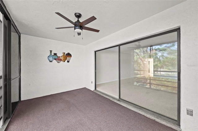 unfurnished bedroom with ceiling fan, a closet, a textured ceiling, carpet flooring, and a textured wall