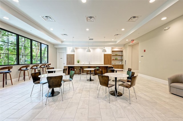 dining area with recessed lighting, visible vents, and baseboards