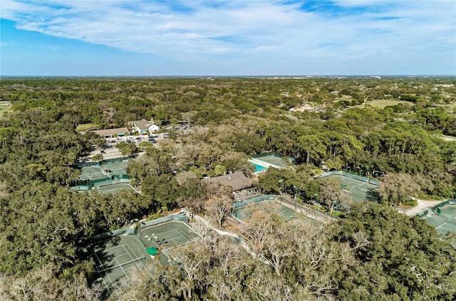 birds eye view of property with a forest view