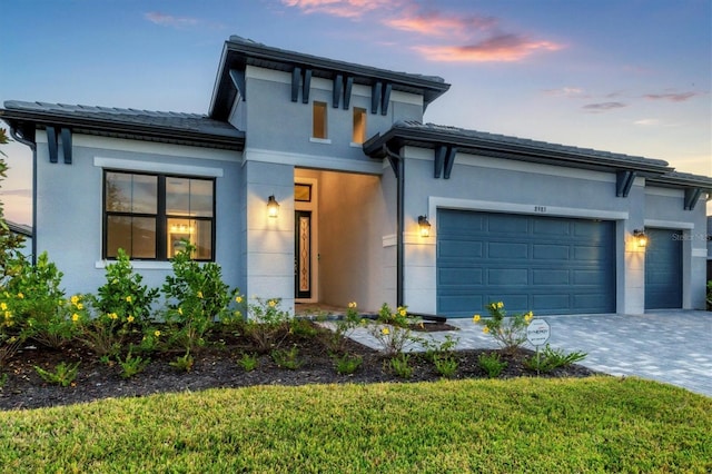 prairie-style house featuring a garage