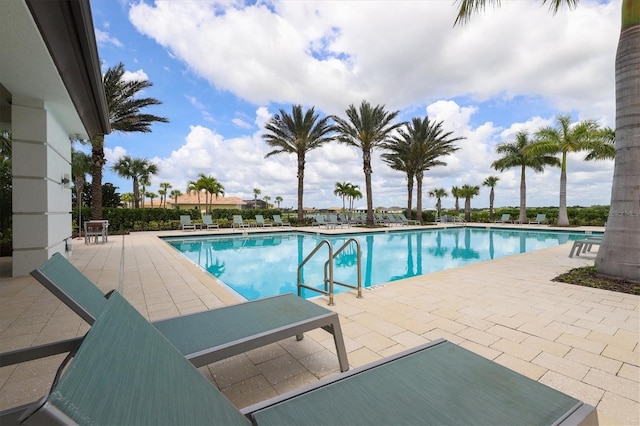 view of swimming pool with a patio area