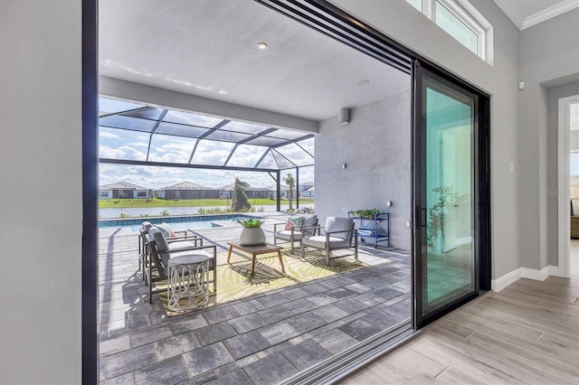 interior space with a water view and a lanai