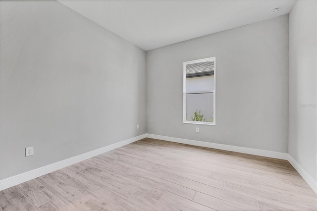 spare room featuring light hardwood / wood-style flooring