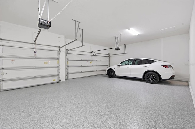 garage featuring a garage door opener