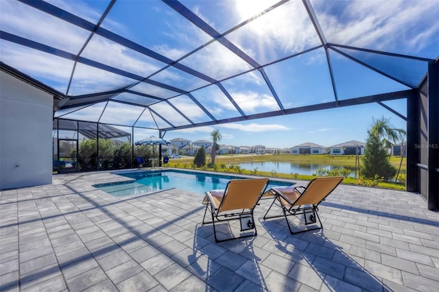 view of swimming pool with a water view, a lanai, and a patio area