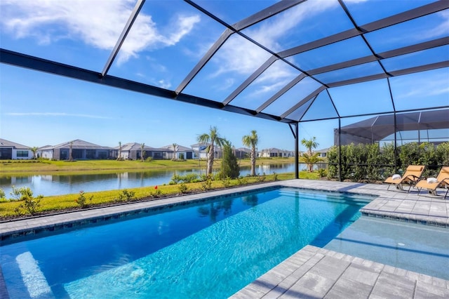 view of pool with a water view, a patio, and a lanai