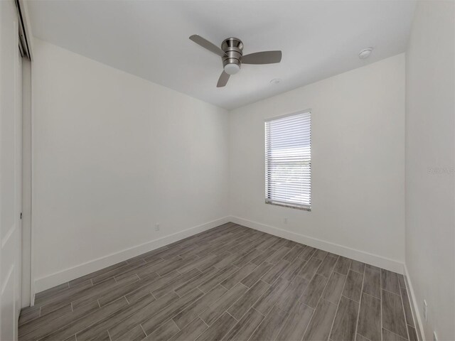 empty room featuring wood-type flooring and ceiling fan