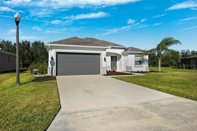 view of front of property featuring a garage and a front lawn