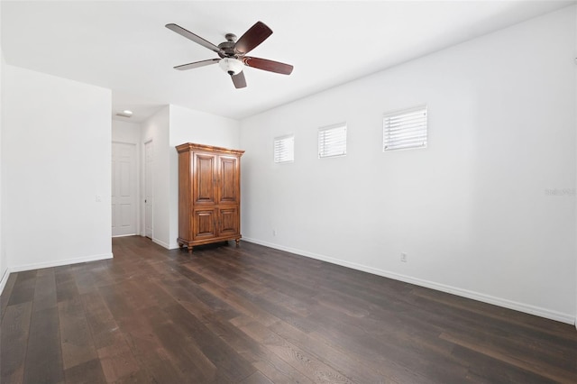 unfurnished room featuring dark hardwood / wood-style floors and ceiling fan