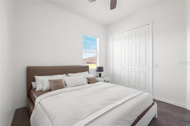 bedroom with a closet, dark wood-type flooring, and ceiling fan