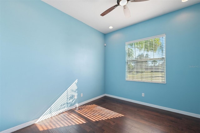 empty room featuring dark hardwood / wood-style floors and ceiling fan