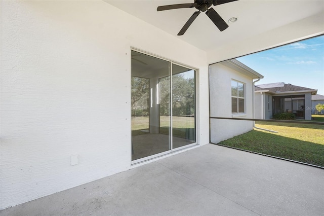 view of patio featuring ceiling fan