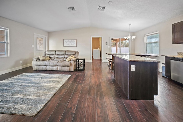 kitchen with decorative light fixtures, dark hardwood / wood-style floors, dishwasher, and dark brown cabinetry