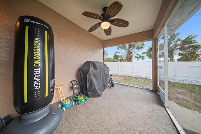 sunroom featuring ceiling fan