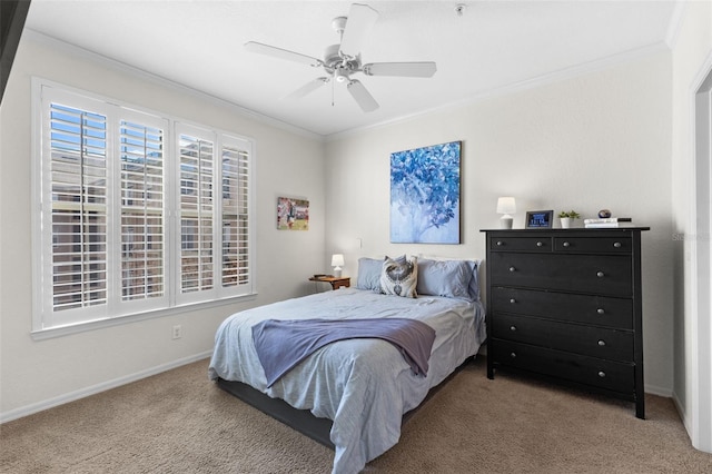 bedroom with ceiling fan, carpet floors, and ornamental molding