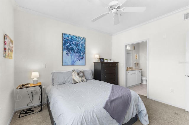 bedroom with ceiling fan, ensuite bathroom, ornamental molding, and light carpet