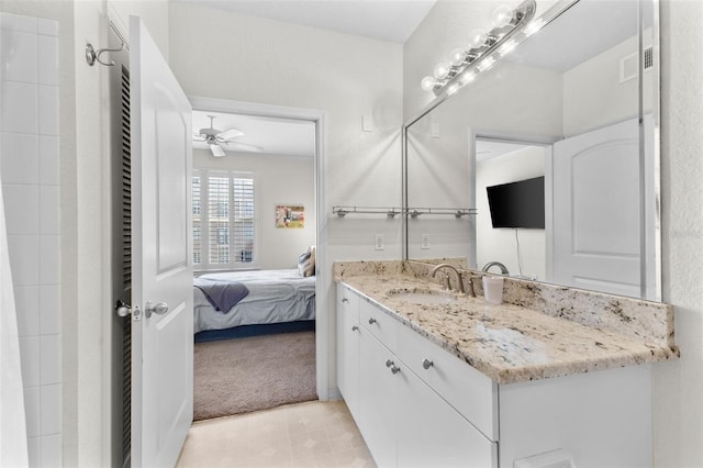 bathroom with ceiling fan and vanity