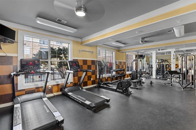 workout area with a wealth of natural light and ceiling fan